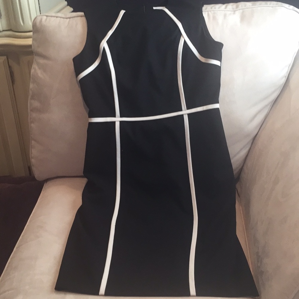 Black sheath dress with cream piping